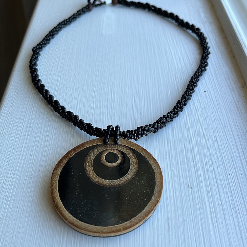 NWT designer black twisted seed bead and large wood reversible pendant necklace